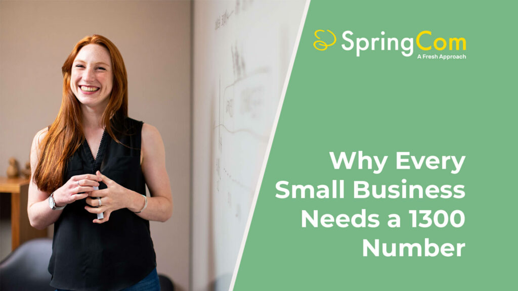 A happy and smiling small business owner setting up a 1300 number